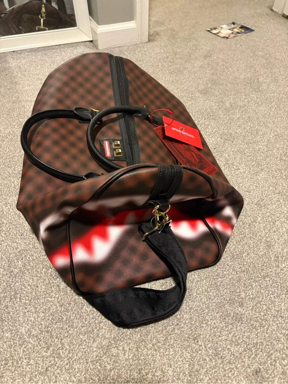 Bape Brown Checked Duffel Bag with Black Handles and Red Tag